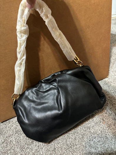 black handbag with gold chain